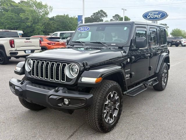 2024 Jeep Wrangler Sahara in Black Clearcoat — front three-quarter view