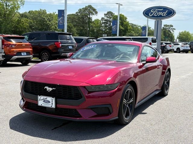 2025 Ford Mustang EcoBoost in Magenta — front three-quarter view