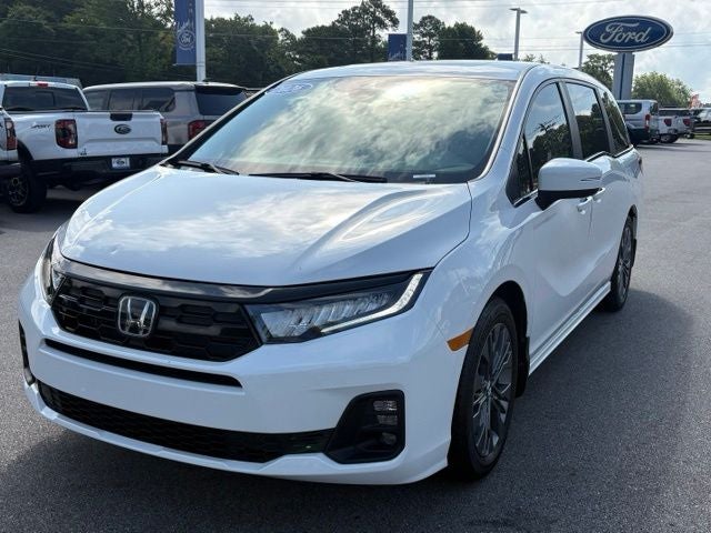 2026 Honda Odyssey Touring in Platinum White Pearl — front three-quarter view