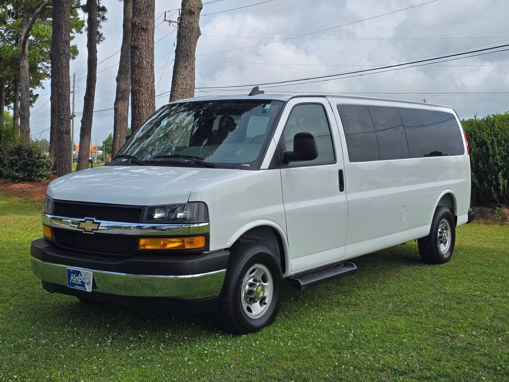 2025 Chevrolet Express Passenger 1LT in Summit White — front three-quarter view