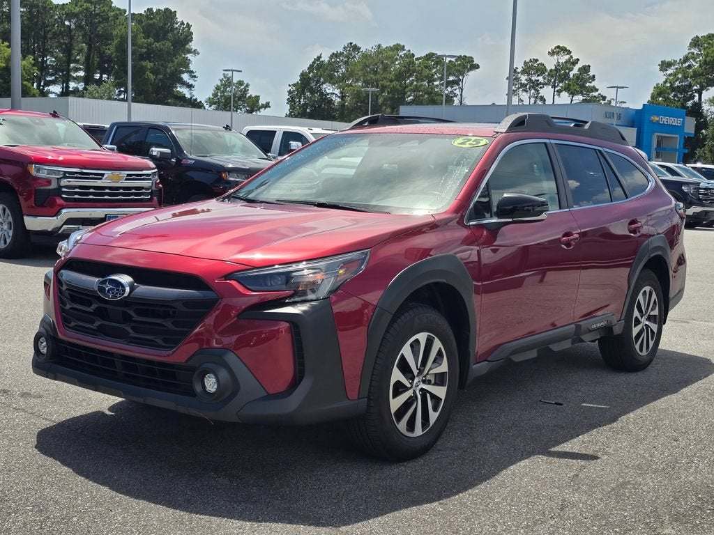 2025 Subaru Outback Premium in Red — front three-quarter view